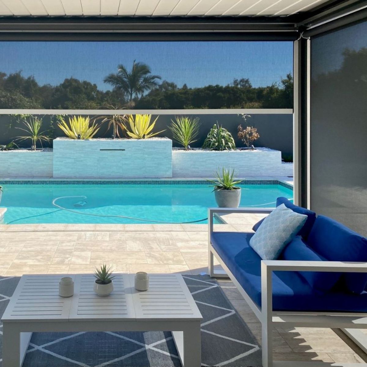 Zipscreen outdoor blinds installed on a Brisbane outdoor area sealing the sides to reduce wind rain and insects